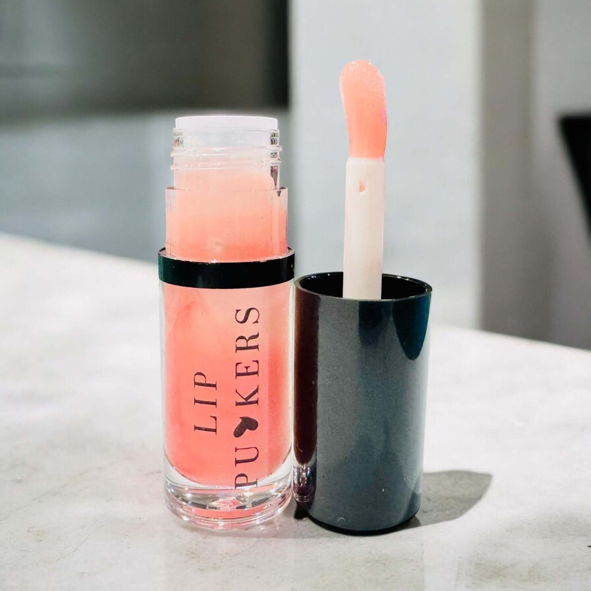 Lip Puckers nourishing lip oil with jojoba, apricot, and vitamin E for hydration and shine without greasiness